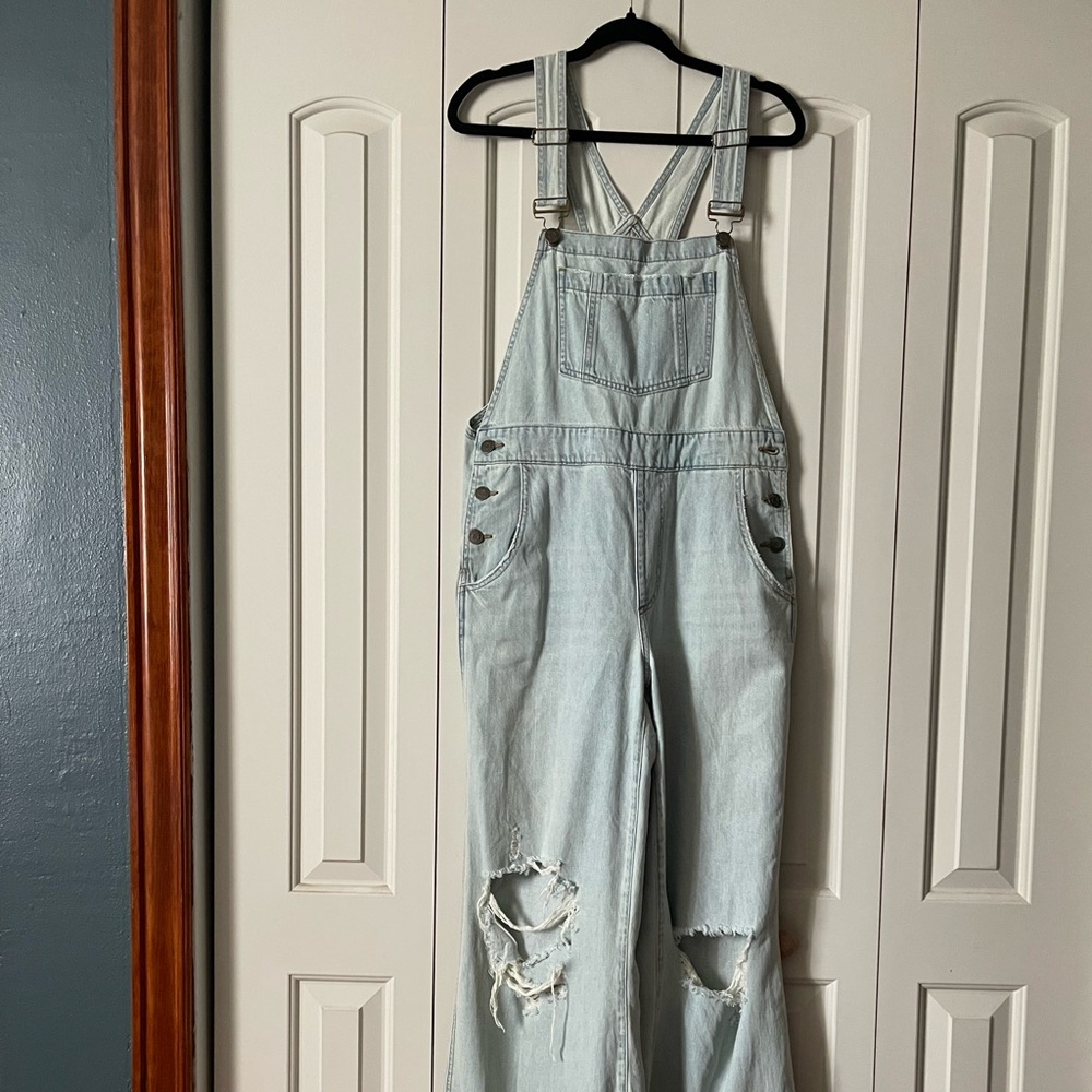 SHOW ME YOUR MUMU Trenton Wide Leg Distressed Overalls in Faded Indigo.